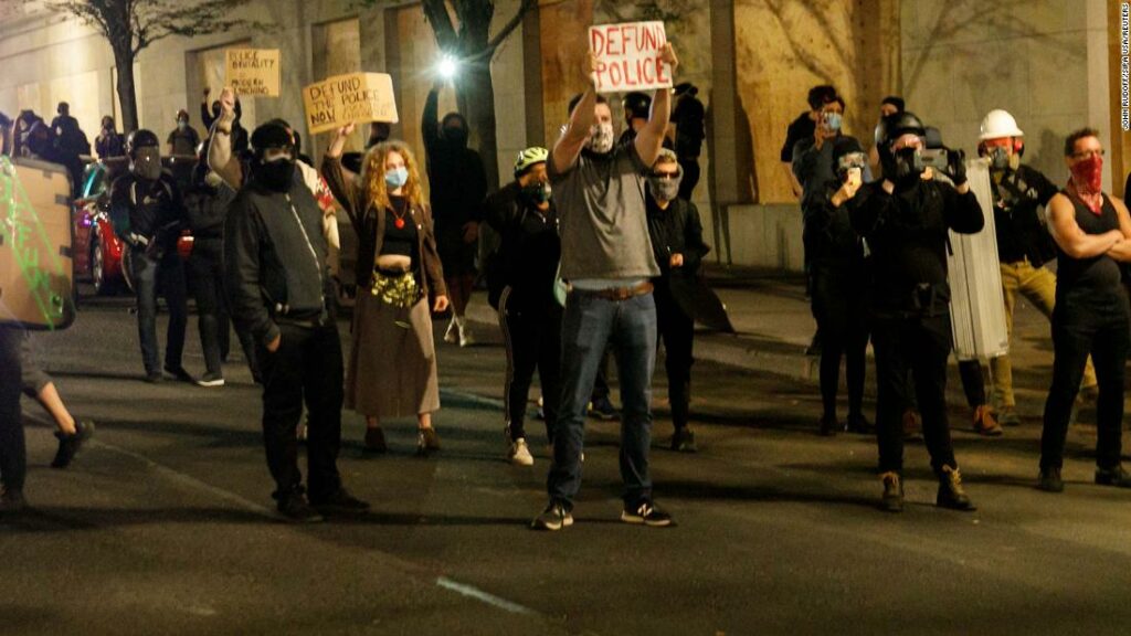 Protesters asked to leave or risk arrest after Portland Police Association office is set ablaze