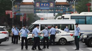 China sees new "wartime" measures over new coronavirus infection