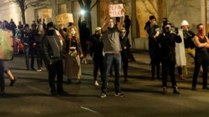 Protesters asked to leave or risk arrest after Portland Police Association office is set ablaze