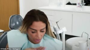 Bye bye! Katie Price has shared a video of herself spitting out her old teeth as she had her veneers replaced while away in Turkey recently