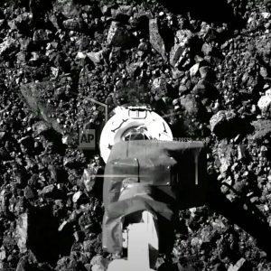 Asteroid samples escaping from a NASA spacecraft jammed