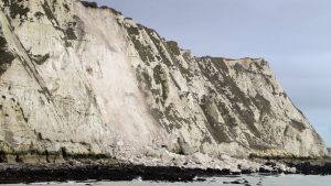 Grid laughs at a broken piece of chalk cliff in Dover SWR3